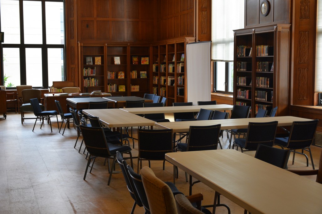  Before: The location for the Indiana Young Readers Center is the old Manuscripts Reading Room. This picture shows the room set up for an event at the State Library earlier in the year. Notice the room did not have carpet, but corkboard covering the original flooring.